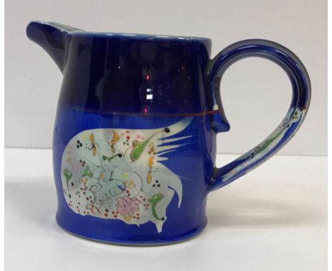 A Martina O'Leary fish decorated jug, designed by Roger Mitchell, signed to base, 12.5 cm high, a similar small vase inscribe