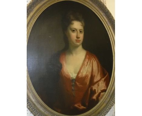 ATTRIBUTED TO SIR PETER LELY (1618-1680) "Young Lady in Red Dress", a portrait study, half length, oil on canvas, oval, unsig