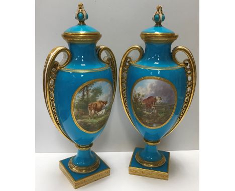 A pair of Vicrorian Minton bleu celeste ground vases in the Classical style, decorated with panels of cattle and sailing vess