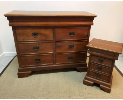 A modern cherry wood chest, the moulded top over two cushion drawers and a bank of six drawers with brass swan neck handles, 