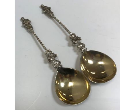 A pair of Victorian silver Apostle spoons in the 17th Century manner with cherubic and barley-twist decorated handle (by Will
