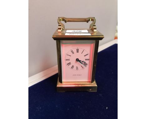 A brass five glass carriage clock, the white enamel dial set with Roman numerals and inscribed "Jean Renet", 14.5 cm includin