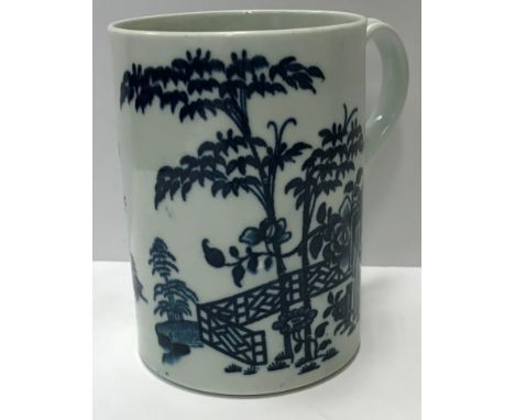 An 18th Century Worcester blue and white mug decorated with bamboo and fence pattern, with dwelling and two birds in foregrou
