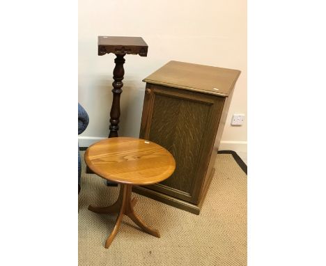 An Ercol style elm pedestal occasional table on quadruped base, 46 cm diameter x 44 cm high, together with an Old Charm oak p