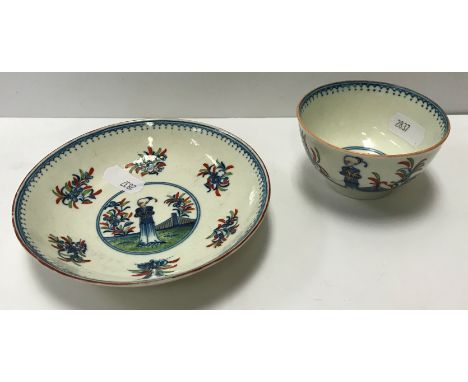 A Caughley tea bowl and saucer circa 1775, polychrome painted in the "Waiting Chinaman" pattern, bowl 7.5 cm diameter x 4.4 c
