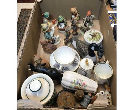 A collection of nine Goebel Hummel figures, including "The Goat Herd", "Hunter with Rabbit", "Boy with Lambs", "Boy with Bird