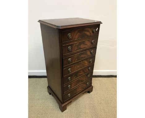 A Bevan Funnell Limited Reprodux mahogany music chest of seven drop front drawers with brass ring handles, raised on bracket 
