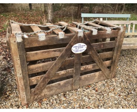 A vintage metal-bound wooden pig weighing crate, bearing enamel plaque "The Cooper Silver Medal Pig Weigher Sole Maker W.J. C