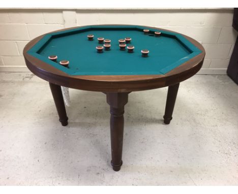 A modern mahogany "Bumper Pool" table, the circular top with baize playing surface on turned legs, 131 cm diameter x 84 cm hi