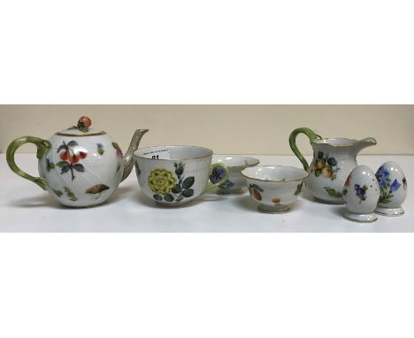 A collection of Herend porcelain tea wares comprising two hot water jugs with lids, one coffee pot (without lid), two teapots