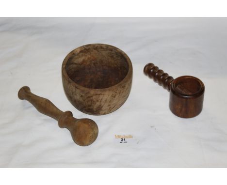 A turned sycamore pestle and mortar, together with a turned wood nut cracker, possibly Laburnum. CONDITION REPORT: These item