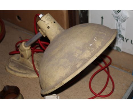 An early 20th century cream enamelled lamp with aluminium shade and heavy cast base. 32 cm diameter x 48 cm high. (Should be 