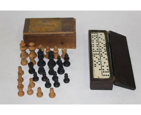 An early 20th century mahogany cribbage board, containing a full set of ivorine dominoes together with an incomplete Cressman