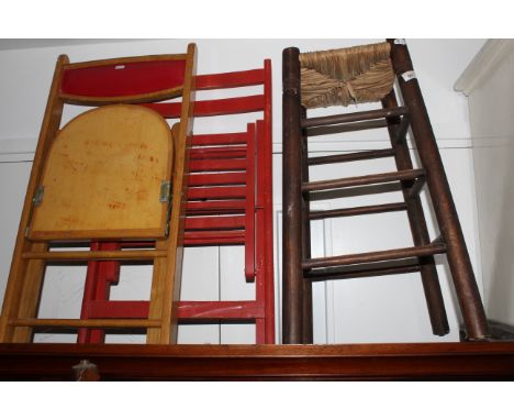 A rustic rush seated stool of traditional form with plain spindle stretchers, 66 cm x 28.5 cm, sold along with two vintage fo