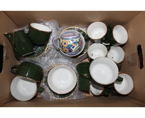 Three boxes of mixed kitchen china, including a Poole pottery jug, decorated in colours with flowers, together with mixed oth