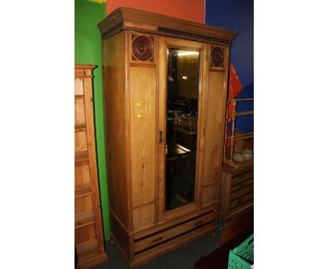 A Victorian ash 2 piece bedroom suite, comprising a mirror door wardrobe and a dressing table. The wardrobe having a moulded 
