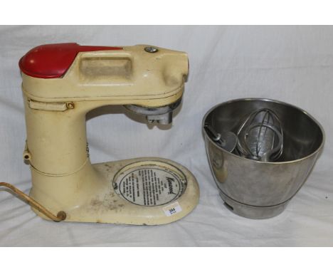 A vintage enamelled metal Kenwood Chef model A700D, sold along with stainless attachments. CONDITION REPORT: In used conditio
