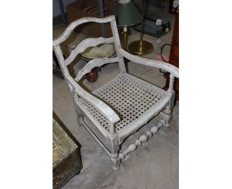 A white painted ladder back low armchair with caned seat, seat height 28.5 cm, sold together with a reproduction Georgian sty