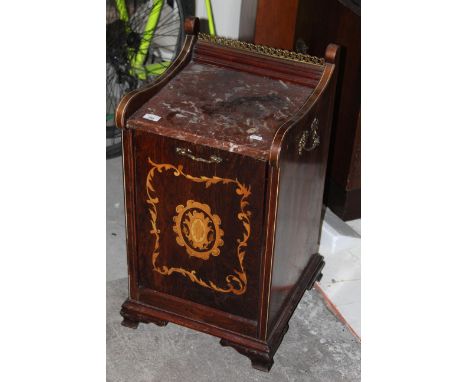A late Victorian inlaid rosewood coal perdonium, having a shallow moulded raised back with gilt metal gallery between string 