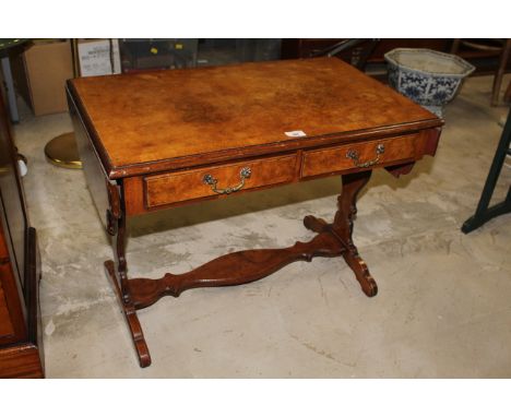 A small reproduction walnut sofa table with a banded quarter veneered top and shaped leaves, above two moulded drawers and a 