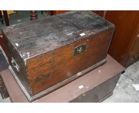 A late 18th/early 19th century oak trunk with twin wrought iron handles, 76 cm x 39 cm x 45 cm. CONDITION REPORT: Slight spli