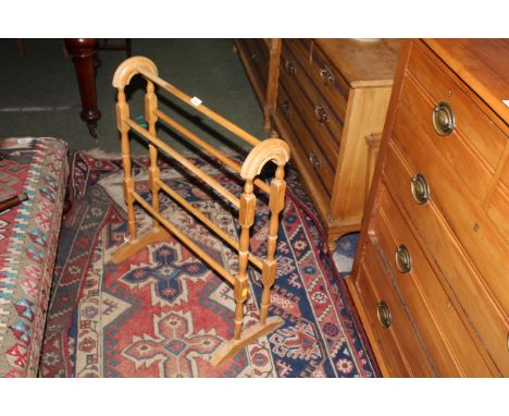 A modern light wood towel rail of traditional form, 77 cm x 62 cm. CONDITION REPORT: Used condition with ware throughout, but
