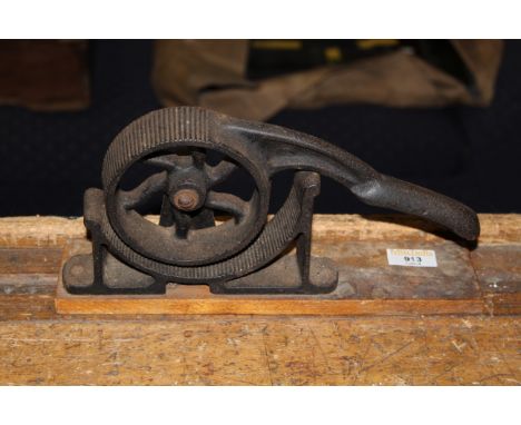 A late Victorian plumbers cast iron bending tool on wood mounts, 30 cm long x 16 cm high. CONDITION REPORT: Light surface rus