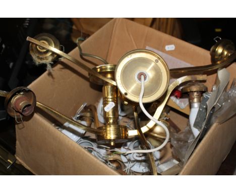 A box of modern and brass effect light fittings. CONDITION REPORT: Used condition with some faults and oxidation to metal par