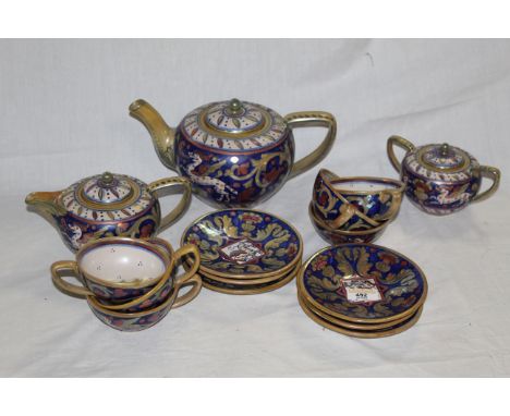 An Italian Majolica lustre tea set comprising a teapot, milk pot, sugar bowl, 6 cups and 6 saucers, decorated in Maiolica sty