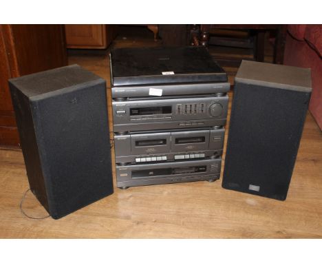 A Sharp music system with stereo turntable, stereo tuner with integrated amplifier, a twin cassette deck and a compact disc p