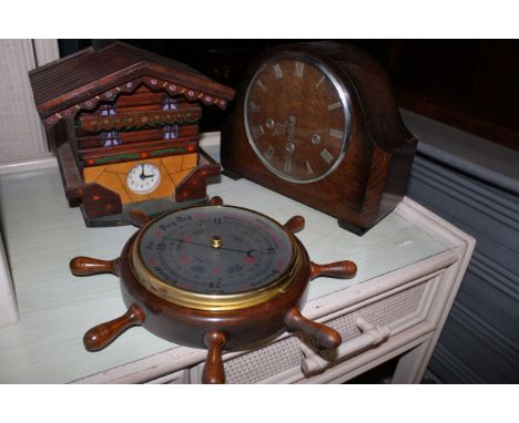 A box of miscellaneous clocks, including a mahogany style wall clock with makers name Legend, a 1930's oak mantle clock with 