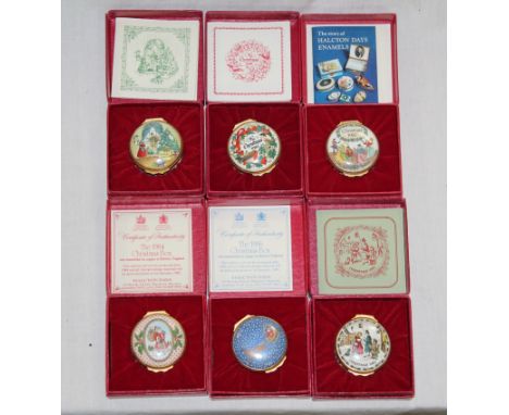 A group of six Halcyon Days Bilston enamel Christmas design circular boxes, each housed in its original box. CONDITION REPORT