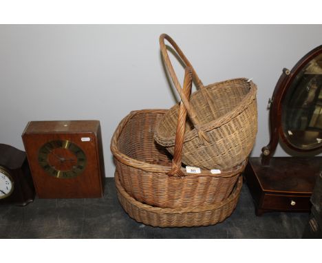 A group of three vintage woven wicker baskets, two with handles. CONDITION REPORT: The two baskets with handles are in genera