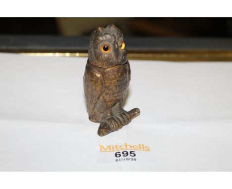 A late 19th/20th century lacquered bronze owl form ink well, the lifting head with glass eyes, 7 cm high. CONDITION REPORT: T
