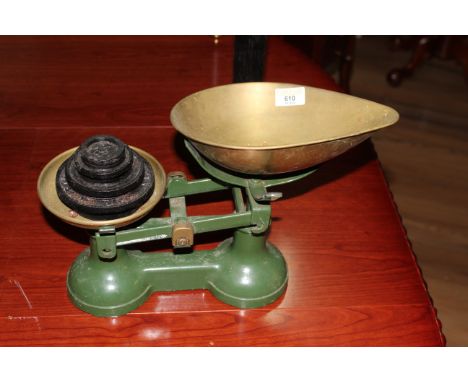 A green painted FJ Thornton &amp; Co Ltd Viking scales with brass pans and sold with four cast iron black painted weights, la