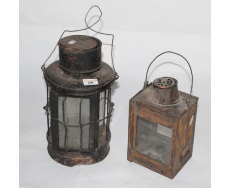 Two vintage metal lanterns, height 32 cm and 25 cm respectively. CONDITION REPORT: Corrosion and paint losses throughout.