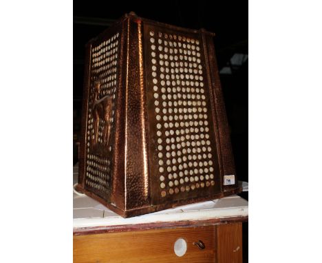 An African planished copper trapezoid framed electric lamp, 40 cm high, (this lamp needs to be re-wired by a qualified electr