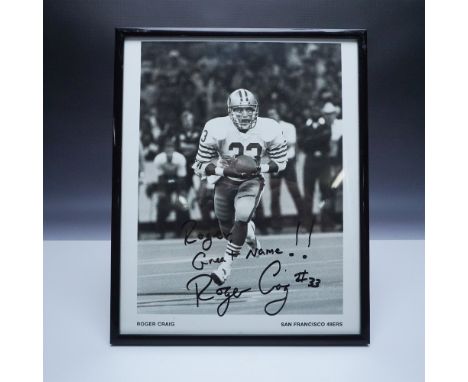 This is an autographed black-and-white photo of NFL legend Roger Craig, known for his pivotal role with the San Francisco 49e