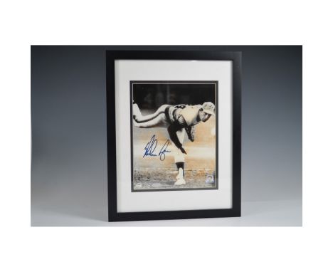 A framed 8"x10" photograph of legendary Major League Baseball pitcher Nolan Ryan, featuring his autograph in blue ink. The im