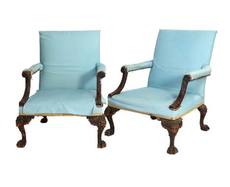 A Pair of George II-Style Carved Mahogany Gainsborough Library Armchairs, 19th century, upholstered in close-nailed duck egg 