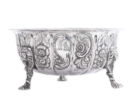 A George II Irish Silver Sugar-Bowl,  by Andrew Goodwin, Dublin, Circa 1740 shaped circular and on three lion-mask capped paw