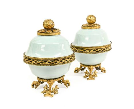 A Pair of French Gilt-Metal-Mounted Chinese Celadon-Glazed Porcelain Pot-Pourri Bowls and Covers, Qianlong mark and of the pe
