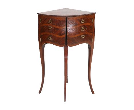 A Late 19th/Early 20th Century French-Style Corner Table, of bowfront form, the triangular top above a pair of cupboard doors