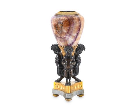 A George III Gilt and Patinated Bronze-Mounted Blue John Vase, with cast stiff leaf borders and pendant pine cone finial supp