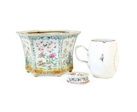 A Chinese Porcelain Mug, Qianlong, of barrel form with entwined strap handle, painted with a monogram in a shield over a rose