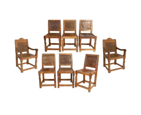 Robert Mouseman Thompson (1876-1955): A Set of Eight (6+2) English Oak Panel Back Dining Chairs, 1936, each armchair with cre
