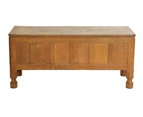 Workshop of Robert Mouseman Thompson (Kilburn): An English Oak Panelled Blanket Chest, post 1960, the rectangular adzed hinge