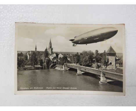 A postcard depicting the Hindenburg airship marked 'Konstanz am Bodensee Partie mit Horst-Wessel-Brucke', postmarked 9/9/36, 