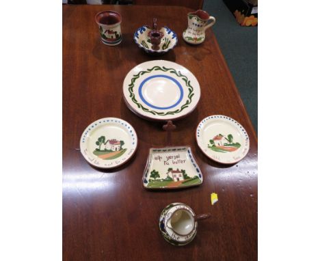 Nine pieces of Watcombe Pottery Torquay motto ware and Devon motto ware including candlestick 'Hear all. See all. Say nothing
