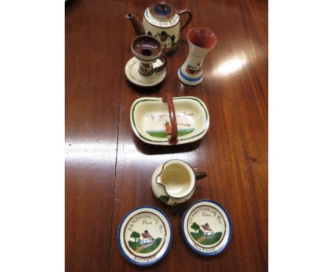Seven pieces of Watcombe Pottery Torquay motto ware, Babbacombe Pottery and Longpark including candlestick 'From Grange-over-